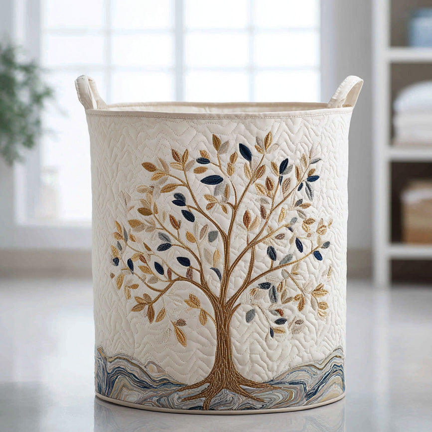 Nadia™ Golden Tree Quilted Laundry Basket, a slender gold tree with small leaves on a cream ground