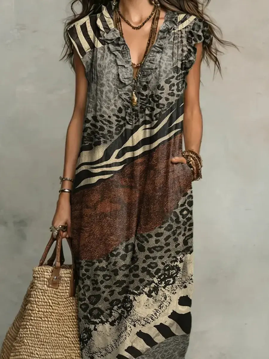 Shirley mixed print maxi dress, full length showing the flowing skirt